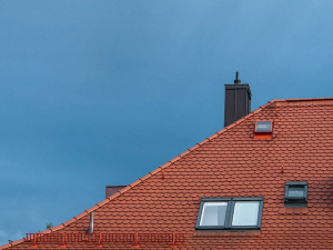 an orange roof with shingles