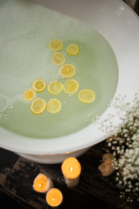 Bath with lemon slices in water