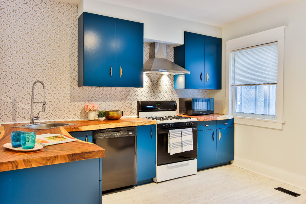 Renovated kitchen with blue-colored cabinets.