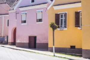 Houses with pink and orange colored walls.