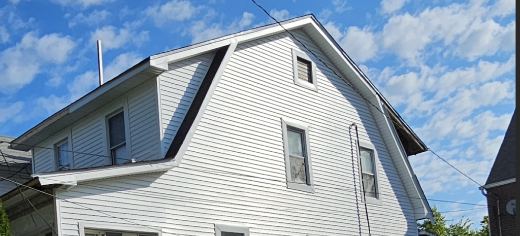 A white house with a low-slope roof