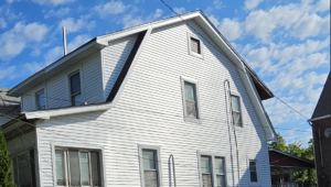 A white house with a low-slope roof