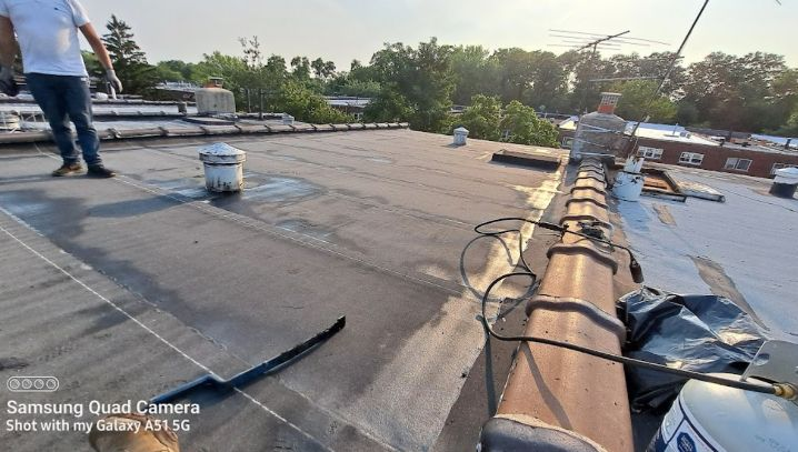 Roofing contractor inspecting a roof