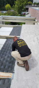 A person working on the roof