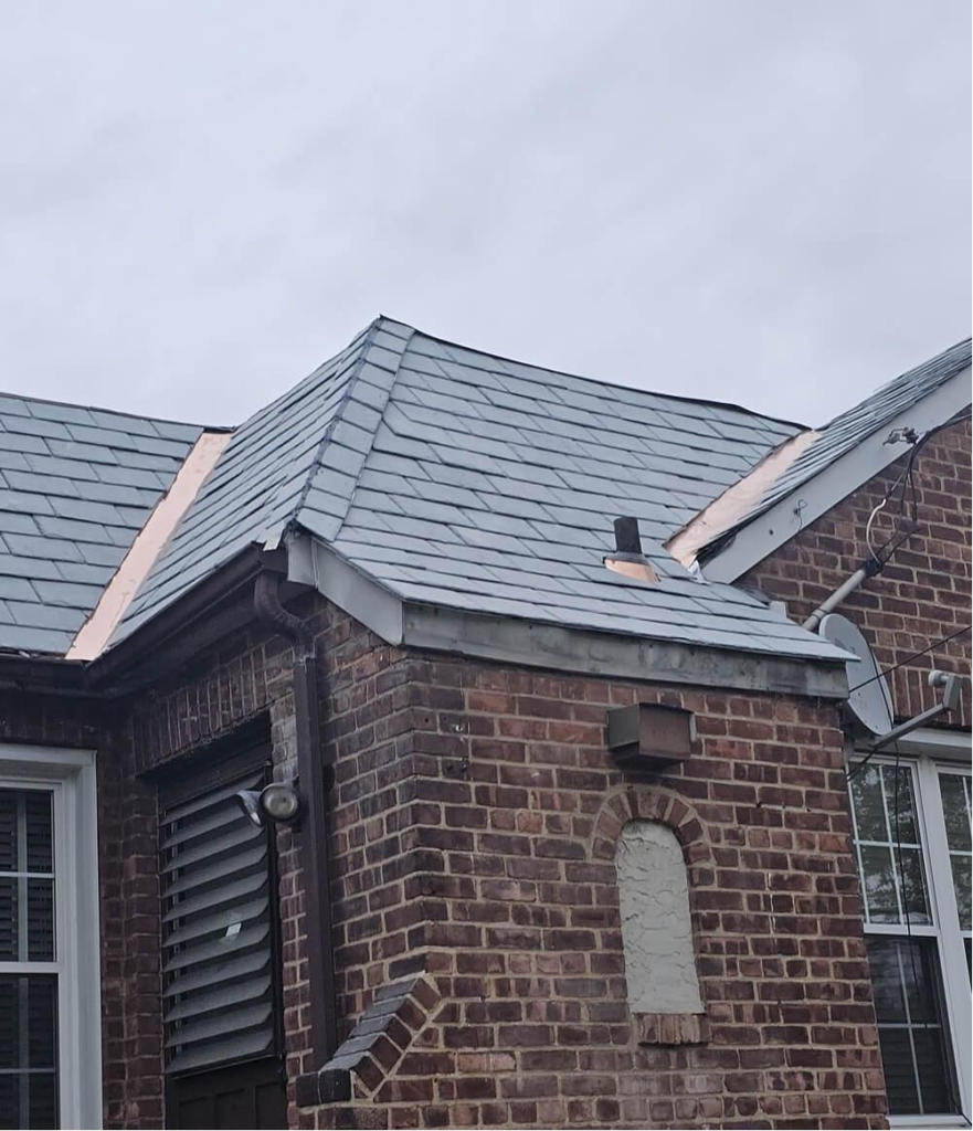 The exterior of a house with a grey shingle roof.