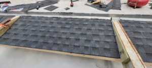 Close-up of impact-resistant asphalt shingles on a roof.