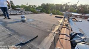 Roofer inspecting a roof