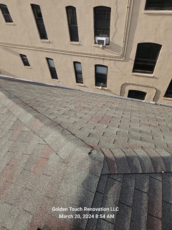 Newly installed reflective roof designed to combat the urban heat island effect in the Bronx.