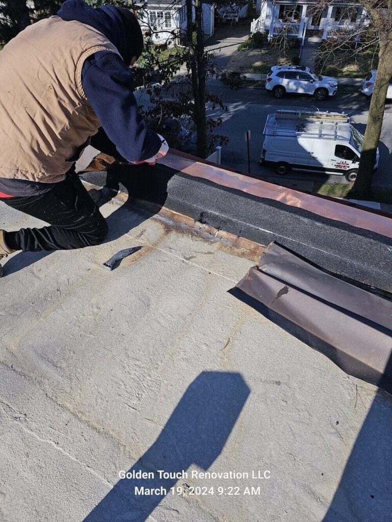 A roofing contractor adjusting or installing a gutter system along the roofline