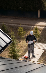 roofing contractor performing a detailed roof inspection on a residential home