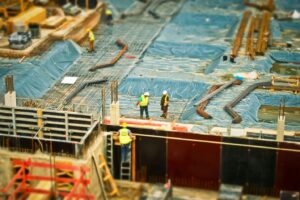 mage of construction workers working on top of a roof