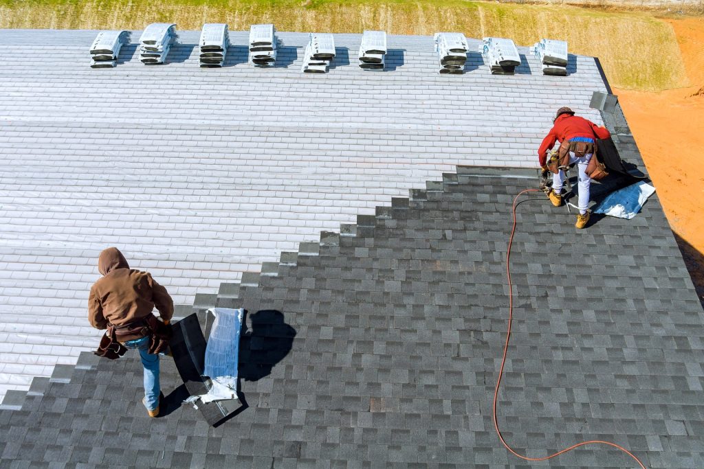 Roofing Contractor in Bronx NY installing asphalt